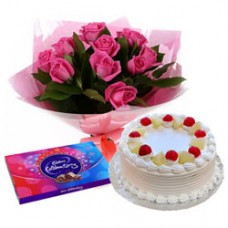 Beautiful Pink Rose Arrangement with Cake and Cadbury Celebration